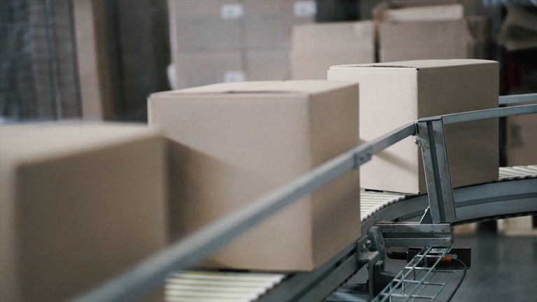  Boxes on a conveyor belt in an end of line packaging process