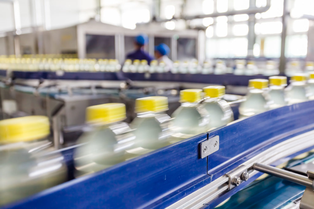  Bottled drinks move on an industrial production line.