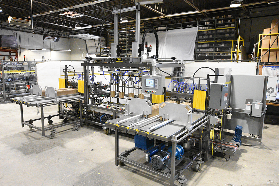  Wayne Automation Quattro 4-head case erector on factory floor