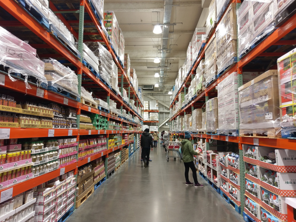 Various types of bulk groceries for sale in a warehouse.