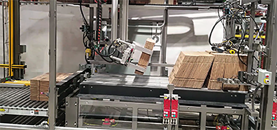 Cardboard box being processed in an automated packaging machine