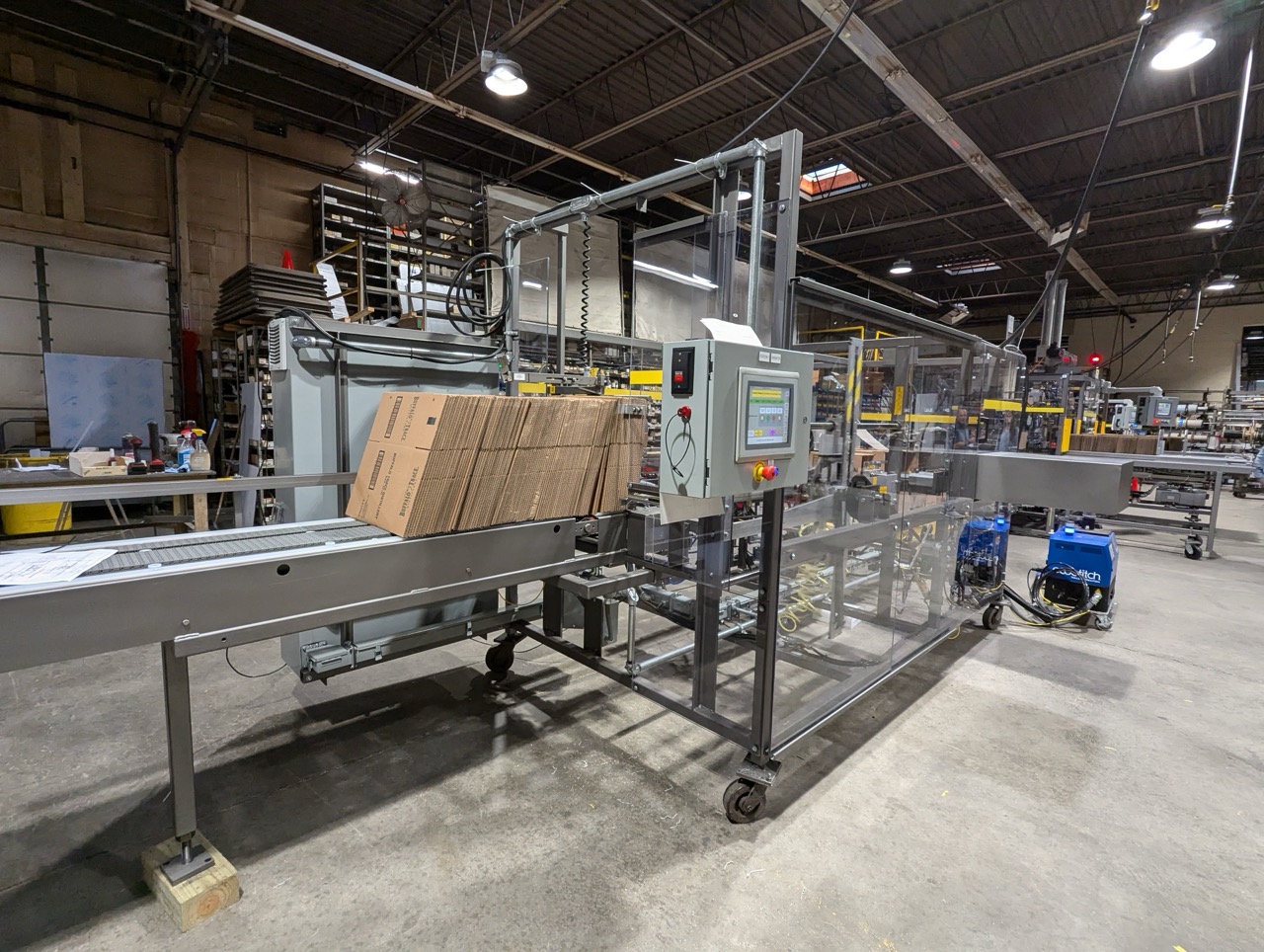 WCE case erector, optimizing snack packaging lines with precise case assembly and streamlined efficiency.