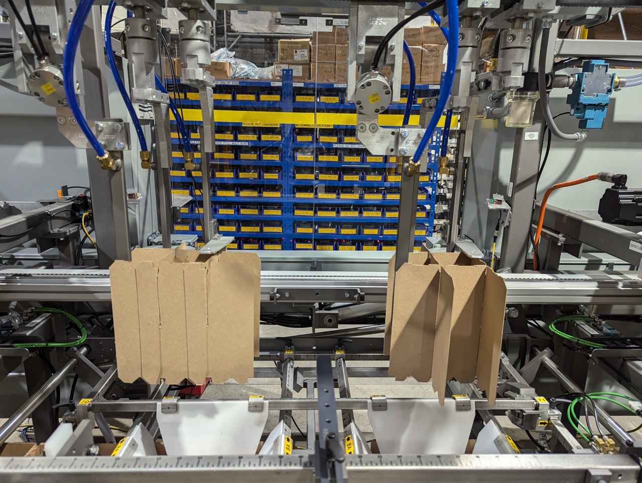 SF-400 Partition Inserter placing internal dividers to stabilize hazardous chemical shipments. 