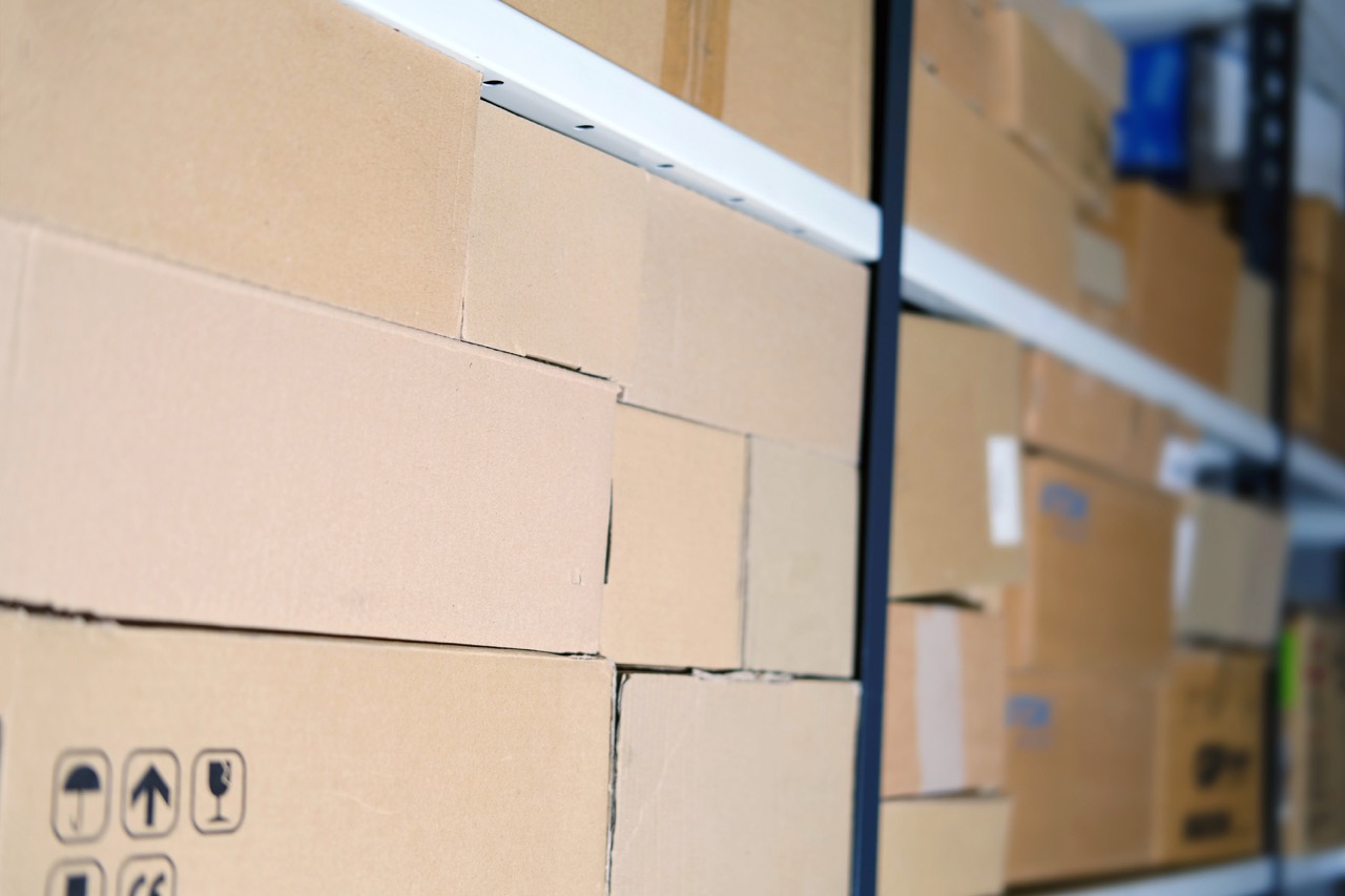Brown Boxes stacked in a pile after being packed by a Wayne Automation Case Packer